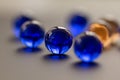 Diagonal line of blue marbles only the centre one is in focus - stock photo.jpg Royalty Free Stock Photo