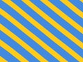 Diagonal yellow stripes on a light blue background. Royalty Free Stock Photo