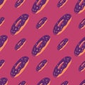 Diagonal located donuts ornament seamless pattern. Purple sweet dessert elements on pink background Royalty Free Stock Photo