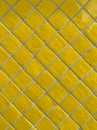 Full frame detail of yellow tiled wall