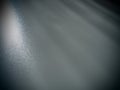 Diagonal rays of light on a gray background. Blurred abstract background light effect, light leaks. Side surface