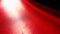 Diagonal rays of light on a red or scarlet background. Blurred abstract background light effect, light leaks. Side