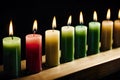 a diagonal row of burning candles