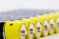 Yellow black AAA alkaline batteries isolated on white