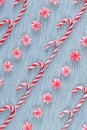 Diagonal rows of Christmas candy canes and peppermint swirl candies flay lay arrangement Royalty Free Stock Photo