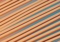 Diagonal rows of parallel, peach-colored rectangular beams create an abstract pattern Royalty Free Stock Photo
