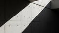 Diagonal shadow cast on modern concrete wall with geometric patterns Royalty Free Stock Photo