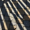 Diagonal shadows cast by vertical objects create alternating dark and Royalty Free Stock Photo