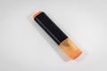 Diagonal shoot of orange colored highlighter pen with white background