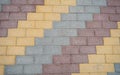 Diagonal striped coloured sidewalk or pavement bricks