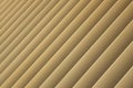 Diagonal view of beige or golden 3d stripes. Louvre shutters like pattern. Royalty Free Stock Photo