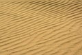 Wavy sand patterns on the beach