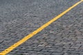 Yellow marking line on the stone pavement   background, abstract Royalty Free Stock Photo