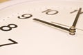 Dial of an analog clock close up. Time 08:55. White dial, black numerals. Sepia toned image Royalty Free Stock Photo