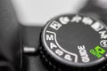 A dial on a DSLR camera pointing towards the Manual mode for photography Royalty Free Stock Photo