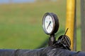 The dial of the gauge of measurement of pressure of a liquid. Oil pump station. Tansport and distribution of oil. Technology of oi Royalty Free Stock Photo