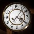 Dial of an old pendulum clock with beautiful figures Royalty Free Stock Photo