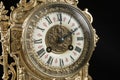 Dial of vintage bronze clock on black background, antique clock photo close up, old bronze clock in gilding, Royalty Free Stock Photo