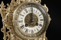 Dial of vintage bronze clock on black background, antique clock photo close up, old bronze clock in gilding, twelve o`clock on the Royalty Free Stock Photo