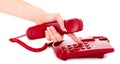 Dialing on the red phone Royalty Free Stock Photo