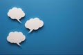 White dialog bubbles on blue background,Generative AI Royalty Free Stock Photo