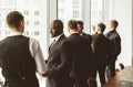 Dialogue of two businessmen in suits working and communicating together in an office. Corporate businessteam and manager Royalty Free Stock Photo