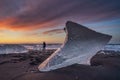 Sunrise at Diamond beach, near Jokulsarlon glacier lagoon, with a photographer Royalty Free Stock Photo