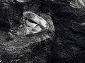 diamond on black coal background Royalty Free Stock Photo