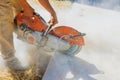 Diamond Blade Saw in Action Construction Worker Cutting Concrete Paving Sidewalk Royalty Free Stock Photo