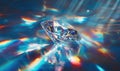 A diamond is on a blue surface with a rainbow effect Royalty Free Stock Photo