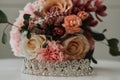 Diamond bridal tiara with a beautiful bouquet in the background