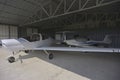 A Diamond DA-40 Diamond Star and a ATEC 321 Faeta retired in the hangar waiting for better weather to take off Royalty Free Stock Photo