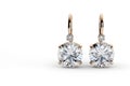 Diamond earrings. Big diamond earrings luxury jewellery on white background. Royalty Free Stock Photo