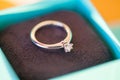 A diamond engagement ring in a box