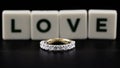 A Diamond And Gold Eternity Ring With Love