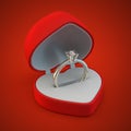 Diamond golden ring in the red heart giftbox.