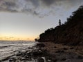 Diamond Head Lighthouse: A Stunning Sunset on Oahu's Rocky Shore Royalty Free Stock Photo