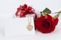 Diamond heart shape pendant and red rose Royalty Free Stock Photo