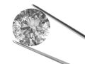 A diamond held in tweezers Royalty Free Stock Photo