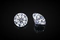 Diamond isolated on black background. Luxury colorless transparent sparkling gemstone diamond round shape cut