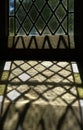 Leaded Glass Window Casting Patterned Sunlight Shadow on Stone Sill Royalty Free Stock Photo