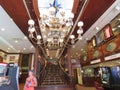 Diamond Lil`s Bar and Grill interior with chandelier and staircase, patrons, Kevin Costner memorabilia, Deadwood South Dakota