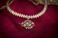 Diamond necklace placed on a red backdrop Royalty Free Stock Photo