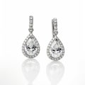 Pear Shaped Diamond Earrings With Hollow Halo Design In 18k White Gold Royalty Free Stock Photo