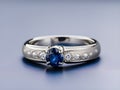 diamond ring with blue gemstone