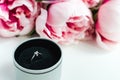 Diamond ring in a box, pink peonies flowers on white background, copy space