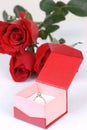 Diamond ring in box and red rose Royalty Free Stock Photo