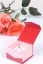 Diamond ring in box and red rose Royalty Free Stock Photo