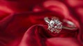 A diamond ring in focus on the red silk background. Royalty Free Stock Photo