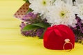 Diamond ring, gift box and flowers. Royalty Free Stock Photo